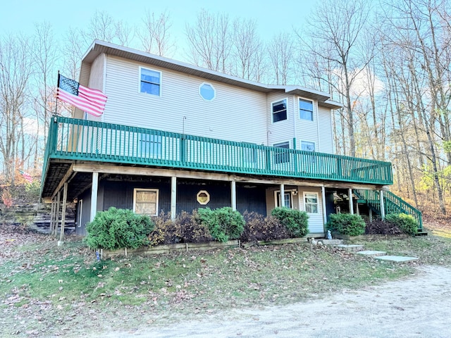 view of front facade with a wooden deck