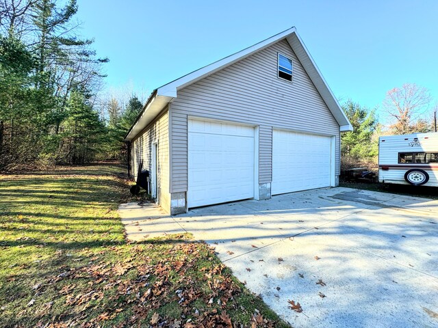 garage featuring a yard