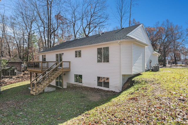 view of property exterior with central AC, a wooden deck, and a lawn