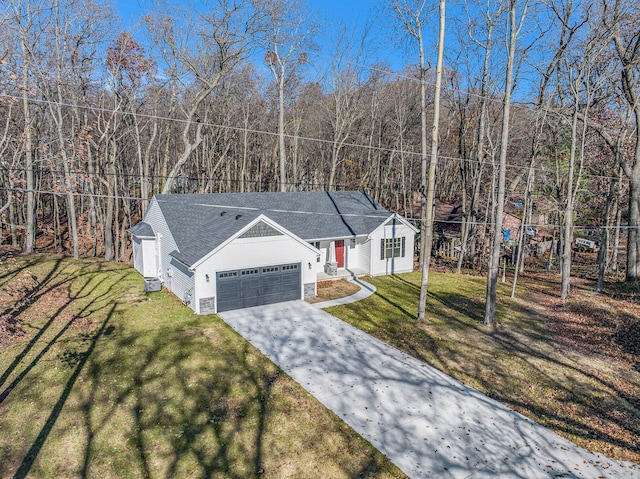 view of front of house featuring a garage and a front lawn