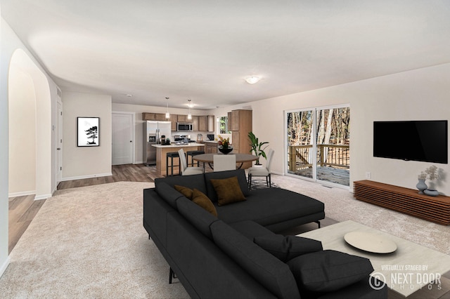 living room with light hardwood / wood-style flooring