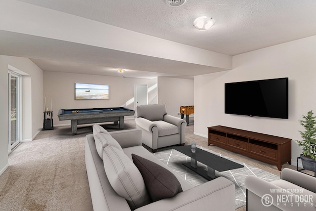 living room with light colored carpet, a textured ceiling, and billiards