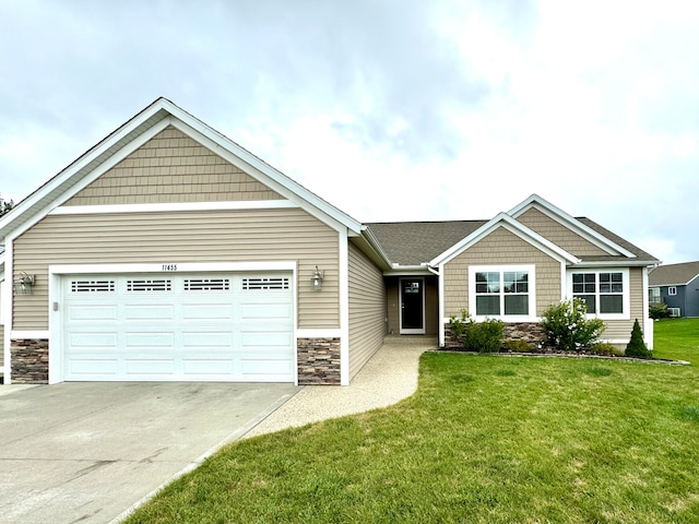 view of front of property with a garage and a front yard