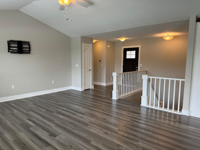 unfurnished room with dark wood-type flooring, ceiling fan, and lofted ceiling