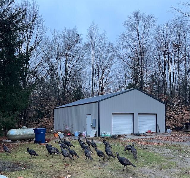 view of outdoor structure with a garage