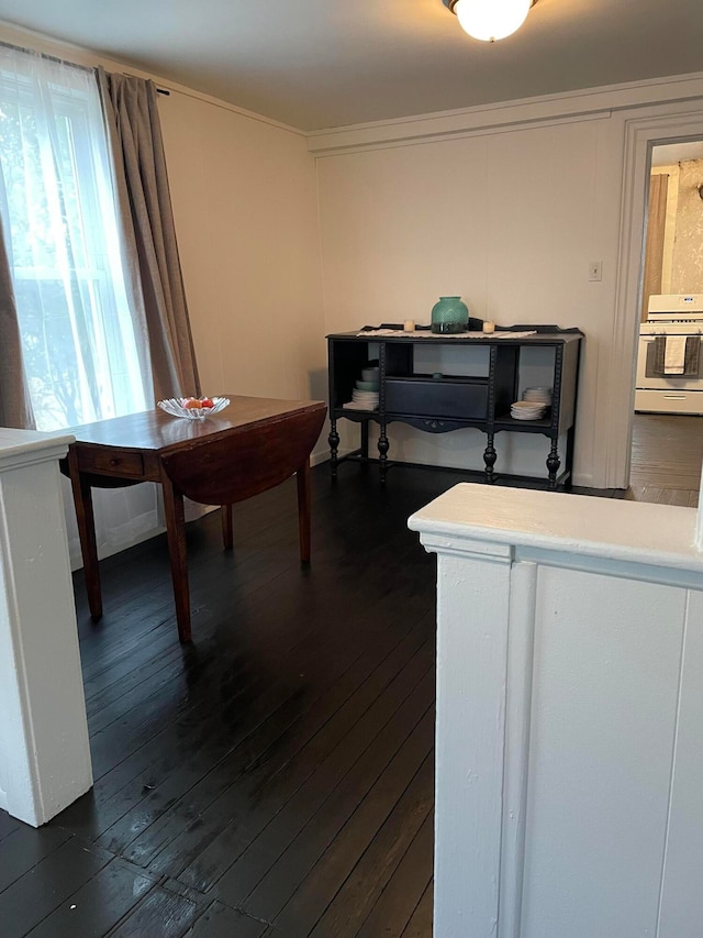 dining space featuring dark hardwood / wood-style floors