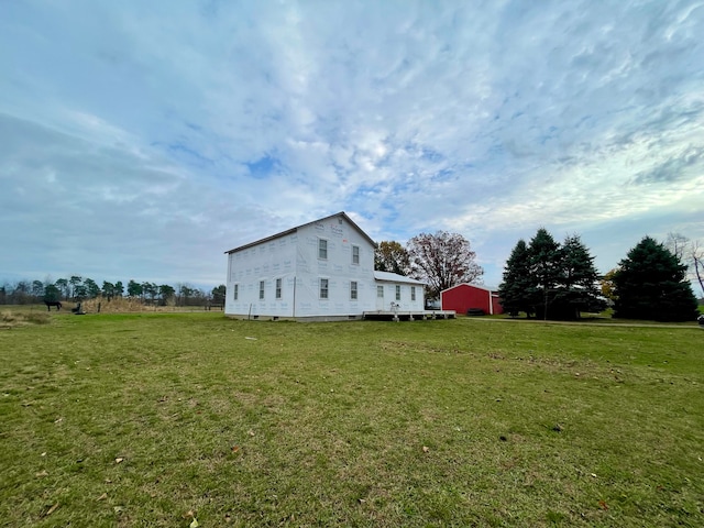 view of side of home with a lawn