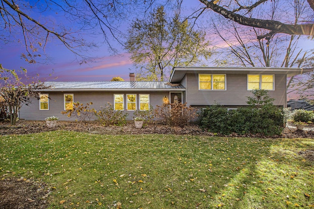 view of front of house with a lawn