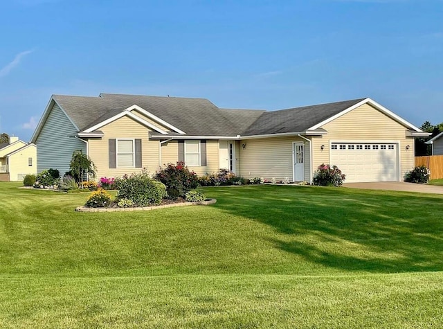 ranch-style home with a front yard and a garage