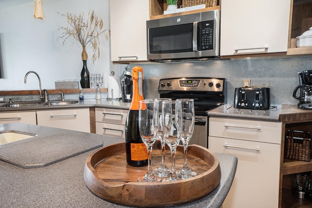 kitchen with stainless steel appliances and white cabinets