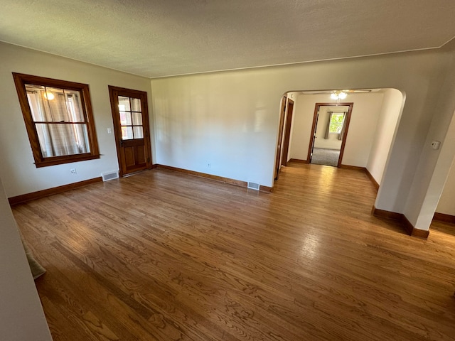 empty room featuring hardwood / wood-style floors and a textured ceiling