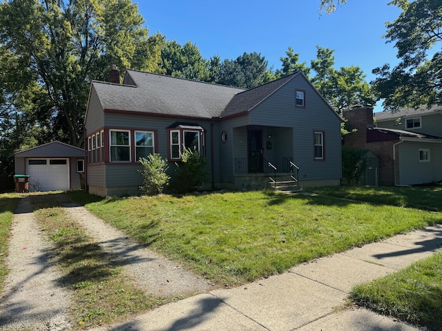 view of front facade featuring a garage, an outdoor structure, and a front yard