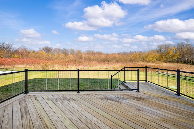 wooden terrace with a lawn