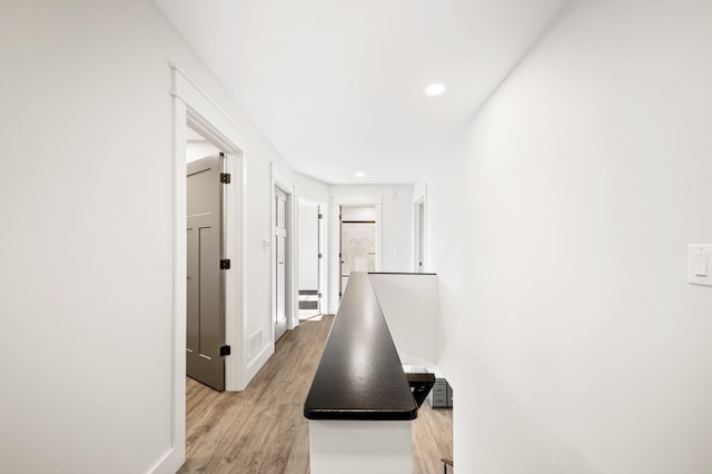 hallway featuring light wood-type flooring