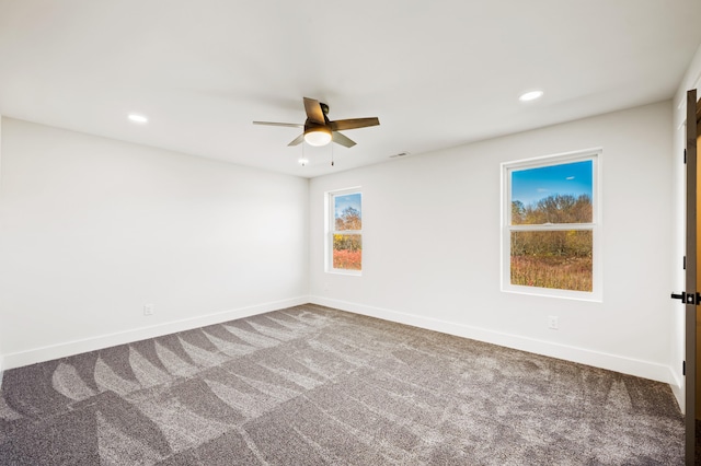 spare room with ceiling fan and carpet floors