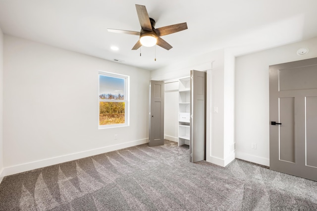 unfurnished bedroom featuring ceiling fan, a closet, and carpet floors