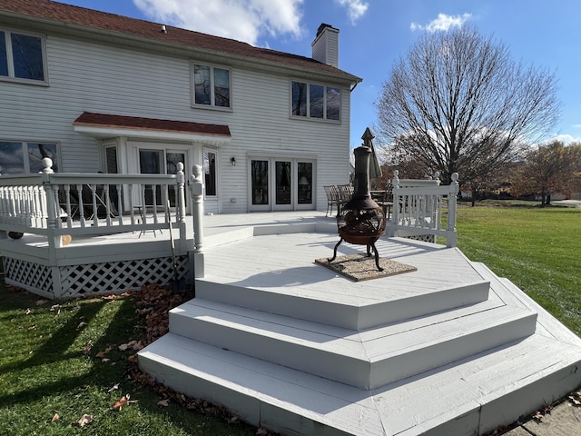 212 Saint Anne Ln, Monroe, MI 48162 - rear view of property with a lawn, a wooden deck, and a chimney