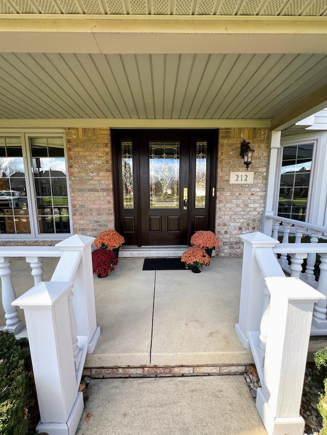 212 Saint Anne Ln, Monroe, MI 48162 - entrance to property featuring covered porch and brick siding