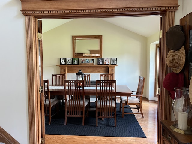 212 Saint Anne Ln, Monroe, MI 48162 - dining room with light wood-type flooring and vaulted ceiling