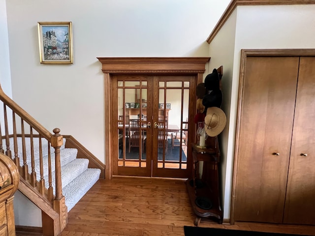 212 Saint Anne Ln, Monroe, MI 48162 - foyer entrance with french doors, hardwood / wood-style floors, and stairway
