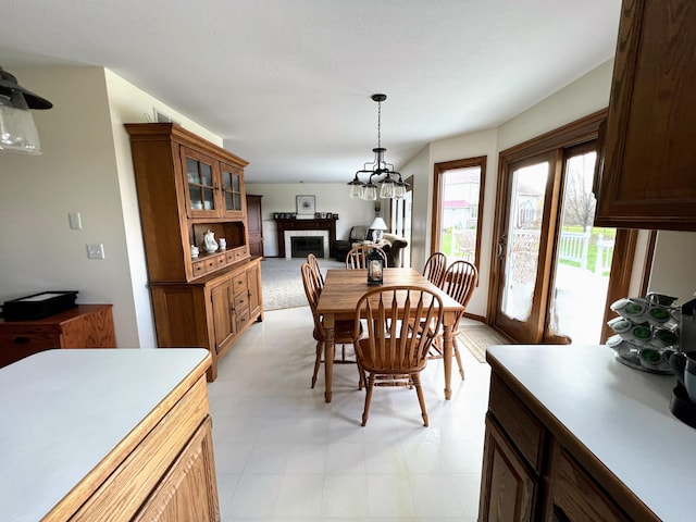 212 Saint Anne Ln, Monroe, MI 48162 - dining space featuring a tile fireplace