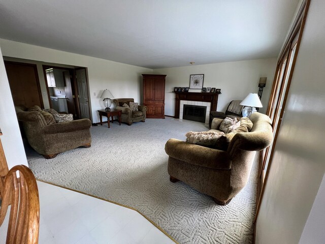 212 Saint Anne Ln, Monroe, MI 48162 - carpeted living room featuring a tiled fireplace