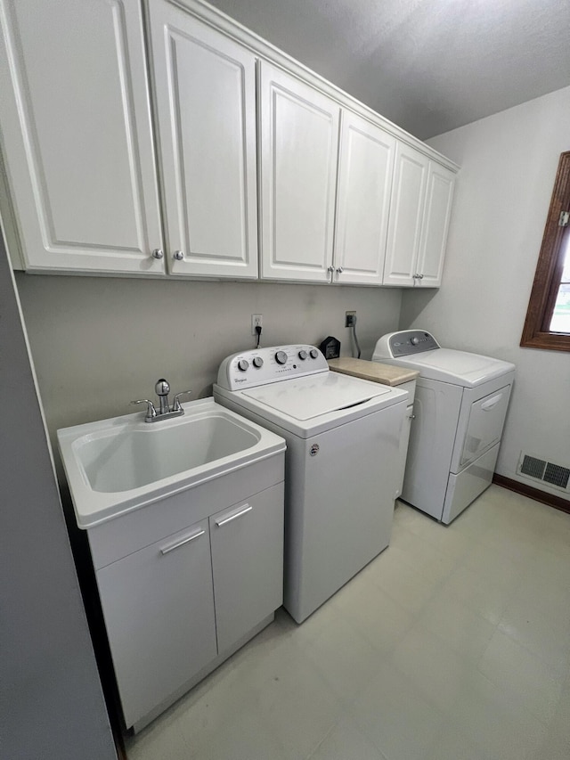 212 Saint Anne Ln, Monroe, MI 48162 - laundry room featuring separate washer and dryer and cabinet space