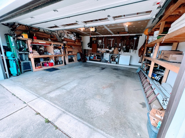 212 Saint Anne Ln, Monroe, MI 48162 - garage with a workshop area and a garage door opener