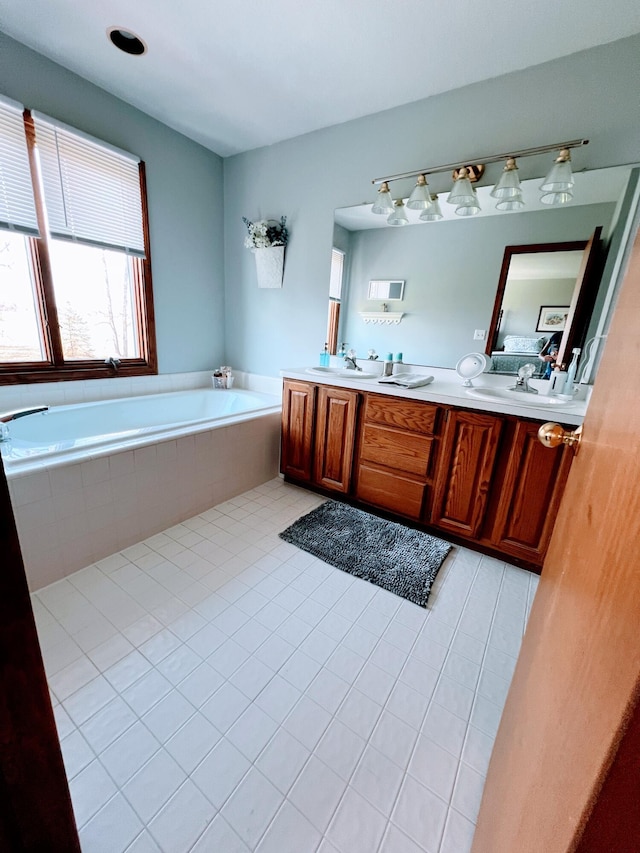 212 Saint Anne Ln, Monroe, MI 48162 - full bath with a bath, double vanity, and tile patterned flooring