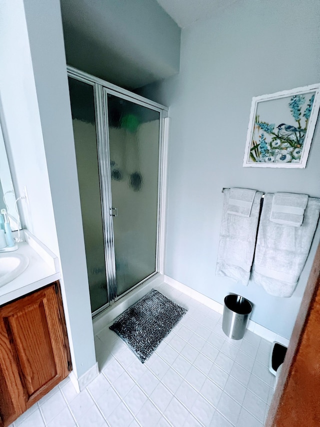 212 Saint Anne Ln, Monroe, MI 48162 - full bathroom featuring a stall shower, tile patterned flooring, and vanity