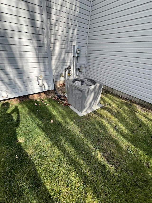 212 Saint Anne Ln, Monroe, MI 48162 - exterior view of central air condition unit and electric meter