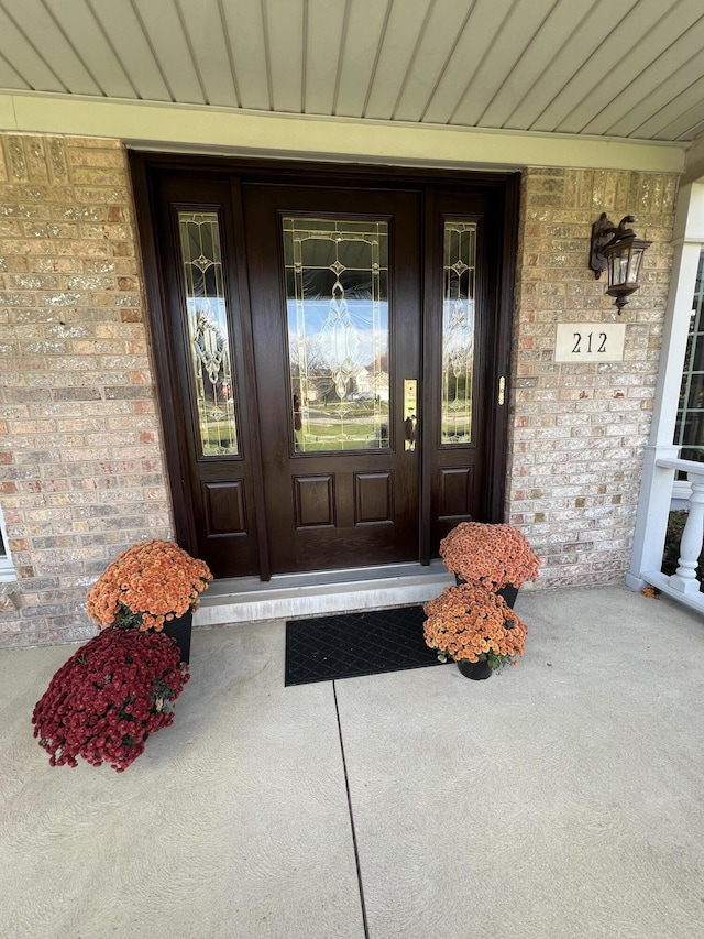 212 Saint Anne Ln, Monroe, MI 48162 - entrance to property with covered porch and brick siding