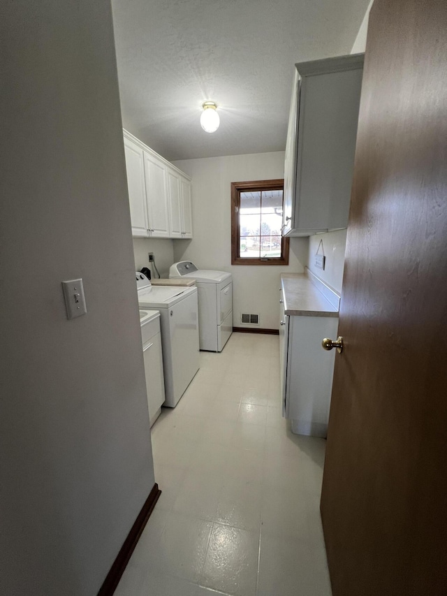 212 Saint Anne Ln, Monroe, MI 48162 - laundry area with washer and dryer, cabinet space, and baseboards