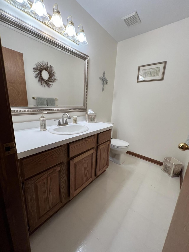 212 Saint Anne Ln, Monroe, MI 48162 - half bath featuring vanity, toilet, and tile patterned floors
