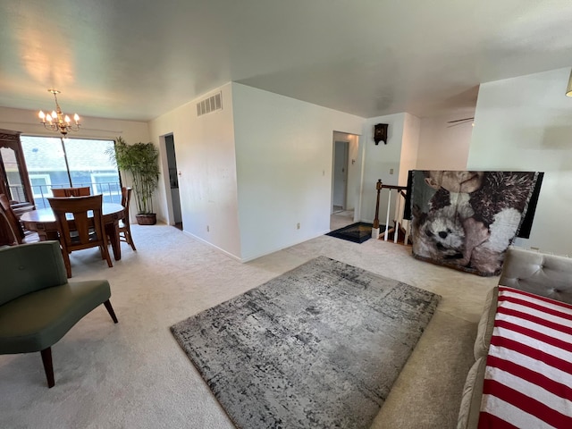 carpeted living room with a notable chandelier