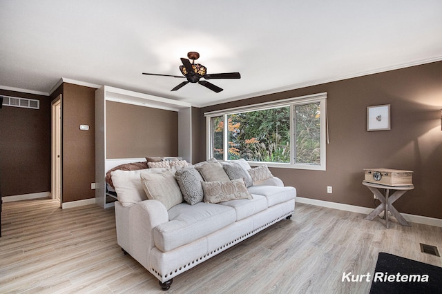 living room with ceiling fan, light hardwood / wood-style floors, and crown molding