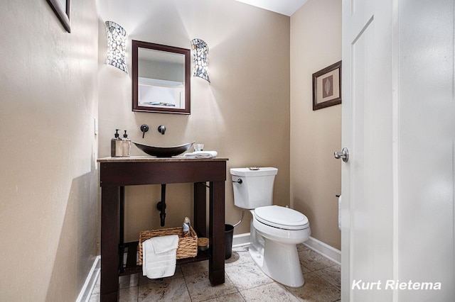 bathroom with toilet and vanity