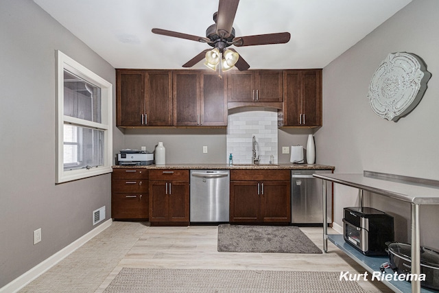 kitchen featuring light hardwood / wood-style flooring, stainless steel dishwasher, sink, and ceiling fan