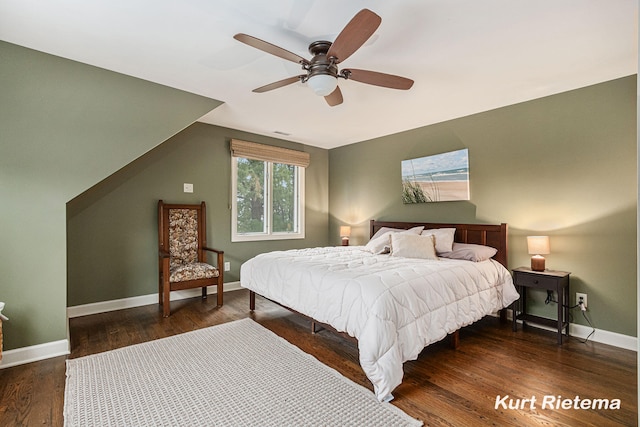 bedroom with ceiling fan and dark hardwood / wood-style floors