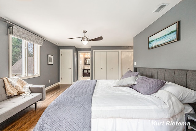 bedroom with ceiling fan and dark hardwood / wood-style floors