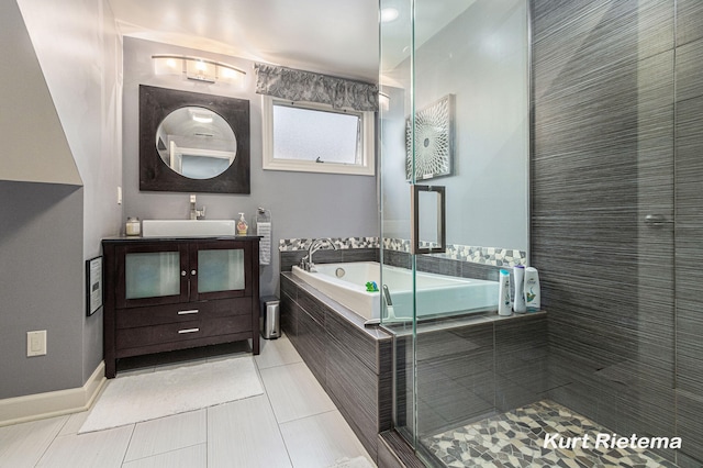 bathroom featuring vanity, tile patterned flooring, and separate shower and tub