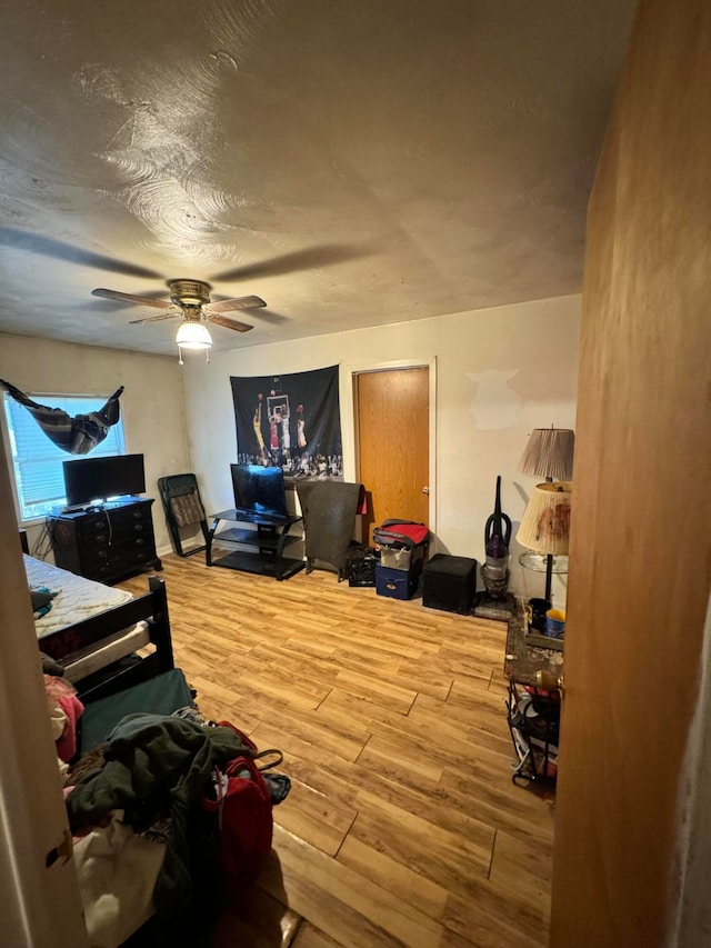 bedroom with hardwood / wood-style flooring and ceiling fan