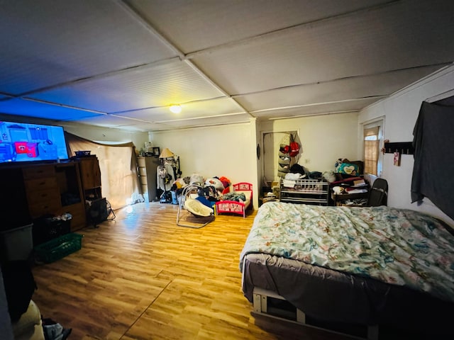 bedroom with hardwood / wood-style flooring