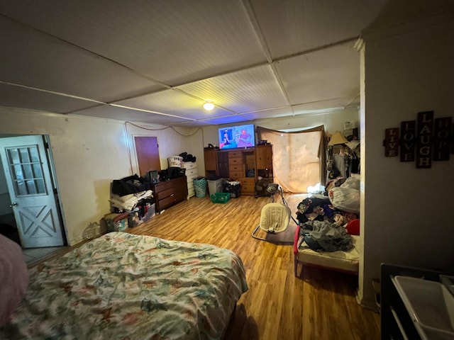 bedroom with hardwood / wood-style flooring