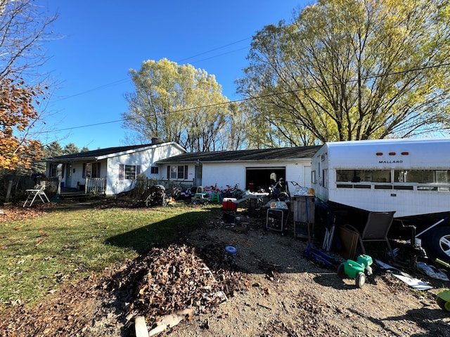 rear view of house with a yard