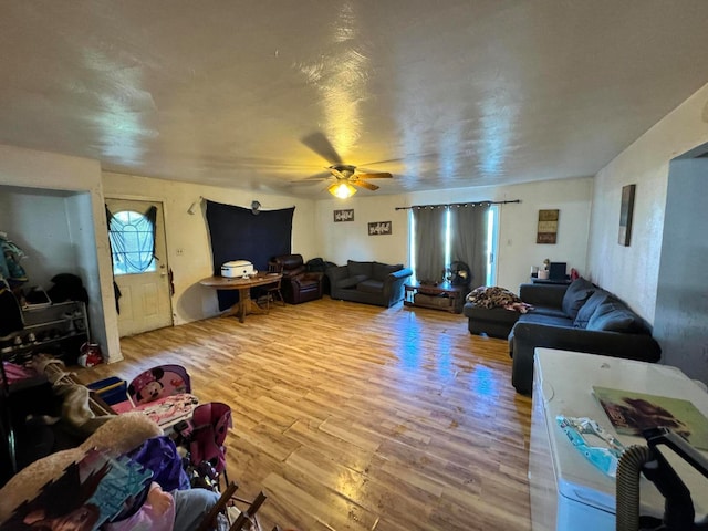 living room with hardwood / wood-style flooring and ceiling fan