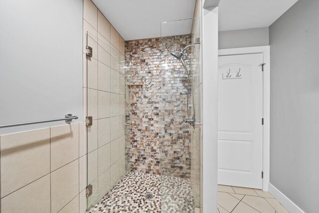 bathroom with tile patterned flooring and an enclosed shower