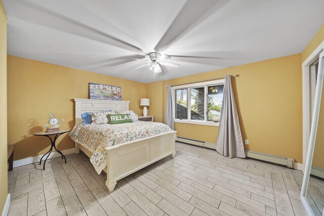 bedroom featuring light hardwood / wood-style flooring and ceiling fan