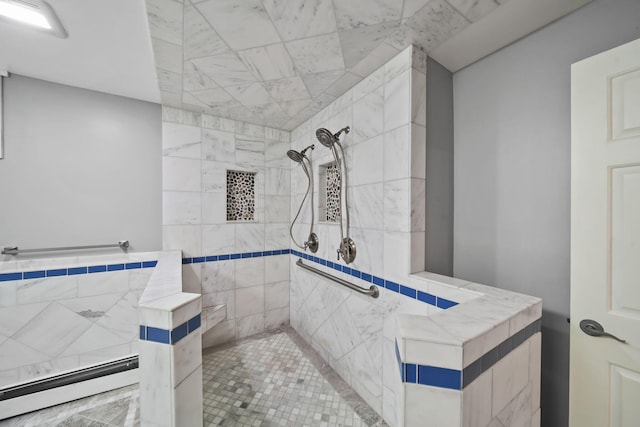 bathroom featuring tiled shower, tile walls, and a baseboard heating unit