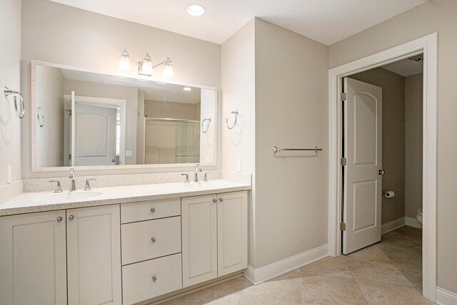 bathroom featuring walk in shower, tile patterned flooring, vanity, and toilet